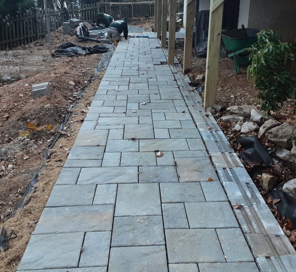 Brick walkway winding through a garden